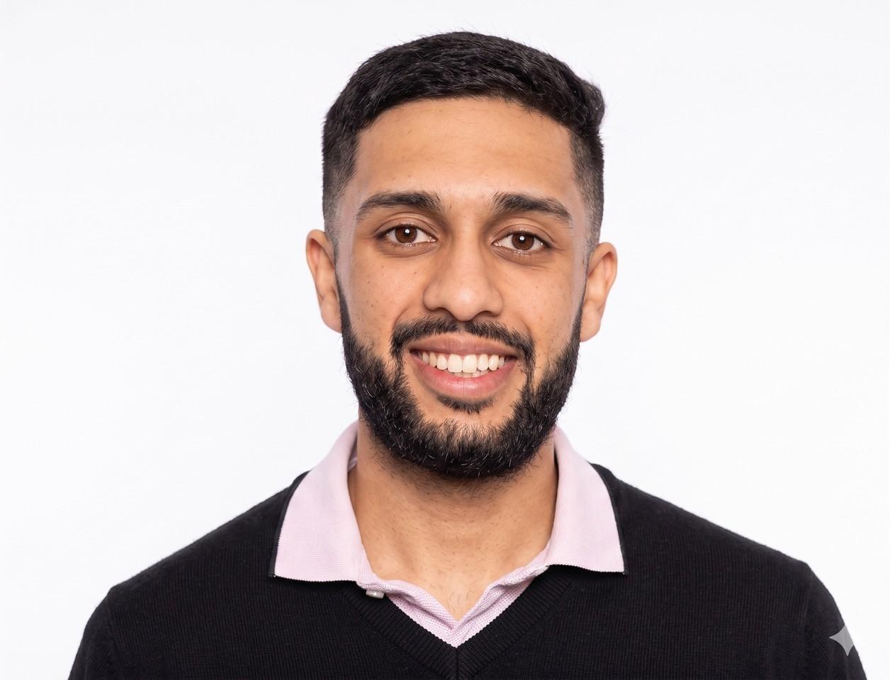 Vipul Sharma, smiling headshot.